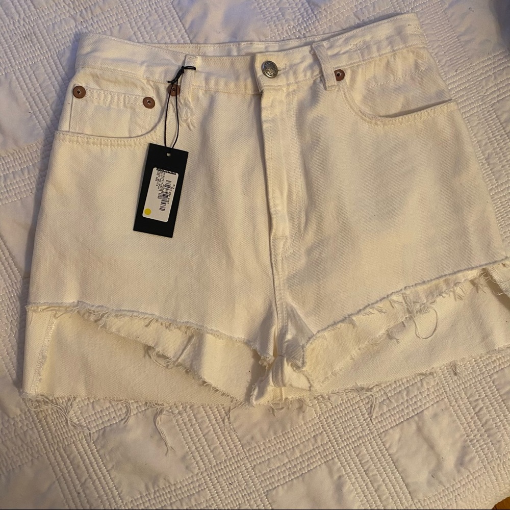 R13 Skirted Short in Nico White premium denim.
Made in Italy